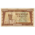 -35- Guinea, 10000 Francs 1958(2), kv. 1-/2, rifter. - Pic12. Flekker. / Numisma Mynthandel A/S: kr.  811,-